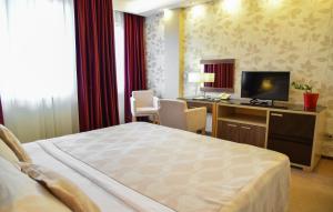 Posteľ alebo postele v izbe v ubytovaní Hotel Tami Residence