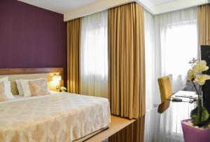 Posteľ alebo postele v izbe v ubytovaní Hotel Tami Residence