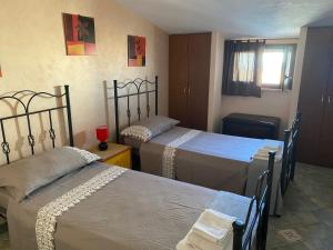 A bed or beds in a room at Ambrosia