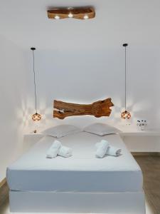 Posteľ alebo postele v izbe v ubytovaní Eternal Suites