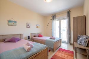 Ένα ή περισσότερα κρεβάτια σε δωμάτιο στο MariZot Apartment