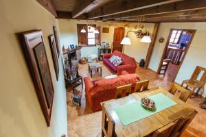 an aerial view of a living room with a table and chairs at Casa Rural La Galana in Sames