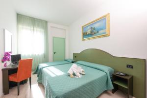 Postel nebo postele na pokoji v ubytování Hotel Sirena