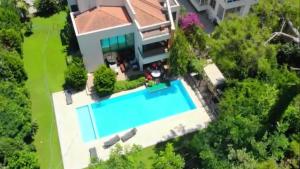 an aerial view of a house with a swimming pool at Villa Diva in Kemer
