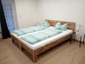 Een bed of bedden in een kamer bij Ferienhof & Café Schnieder