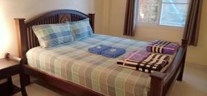 Postel nebo postele na pokoji v ubytování DoiTung Homestay ดอยตุงโฮมสเตย์