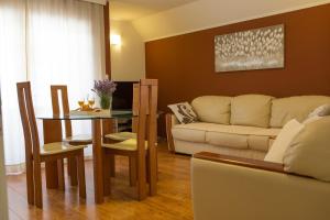 a living room with a table and a couch at Apartment Mario in Otočac
