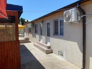 a building with a television on the side of it at Casa Raul Eforie Sud in Eforie Sud +21 photos
