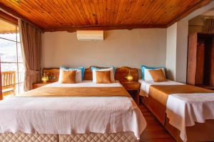 Postel nebo postele na pokoji v ubytování Keyif Motel
