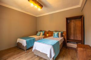 Postel nebo postele na pokoji v ubytování Keyif Motel