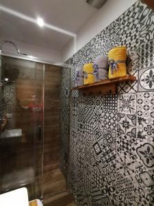 a bathroom with a shower and a glass shower stall at Studio Krakow old town apartment in Krakow