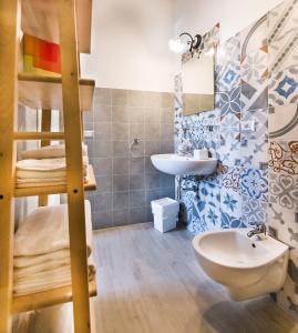 a bathroom with a bunk bed and a sink at La stanza dell'angolo in Maratea