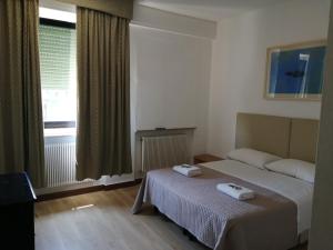 Postel nebo postele na pokoji v ubytování bellaria