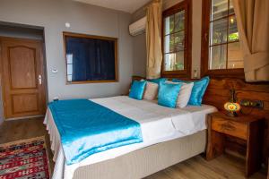 Postel nebo postele na pokoji v ubytování Keyif Motel