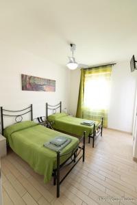 A bed or beds in a room at B&B Casa Fortuna
