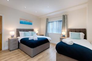 Ένα ή περισσότερα κρεβάτια σε δωμάτιο στο Eaton House 2 - TV in Every Bedroom!