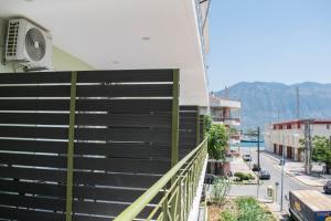 a balcony of a building with a view of a street at Vista Marina in Kalamata