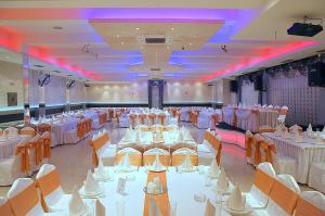 a banquet hall with white tables and chairs at ESTRADA Lux in Belgrade +4 photos
