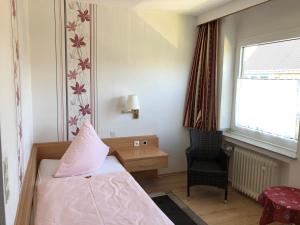 Postel nebo postele na pokoji v ubytování Hotel Haus am Rieth