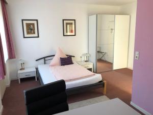 Postel nebo postele na pokoji v ubytování Hotel Haus am Rieth