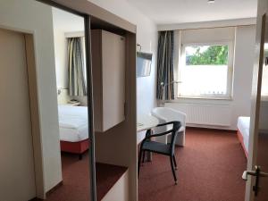 Postel nebo postele na pokoji v ubytování Hotel Haus am Rieth