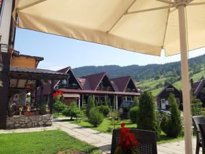 a view of a house with an umbrella at Vila Rudi Toni in Boge