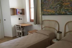 VelaLatina Residence B&B Soverato tesisinde bir odada yatak veya yataklar
