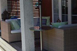 a patio with a table and chairs on a porch at Box58 in Eisenstadt +128 photos