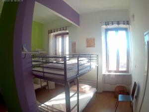 a room with two bunk beds and a window at Anchi Guesthouse in Dubrovnik