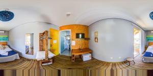 a room in a house with two beds at Alma Brava in Itajaí +80 photos