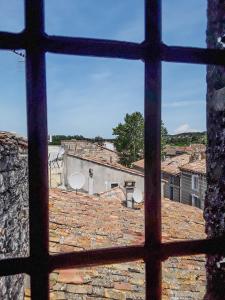 a view of a city from a window at Studio entre Cévennes et Camargue in Montfrin