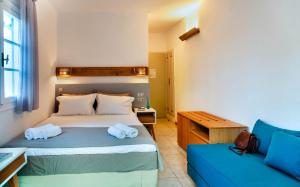 Llit o llits en una habitació de Nefeli Hotel