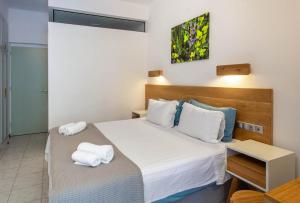 Llit o llits en una habitació de Nefeli Hotel