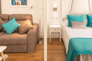 A bed or beds in a room at AiA LOFT BIBRAMBLA