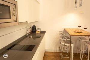 A kitchen or kitchenette at AiA LOFT BIBRAMBLA