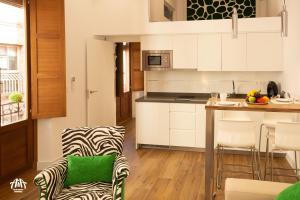 A kitchen or kitchenette at AiA LOFT BIBRAMBLA