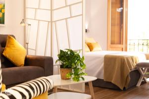 A bed or beds in a room at AiA LOFT BIBRAMBLA
