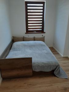 Posteľ alebo postele v izbe v ubytovaní Apartament LUX