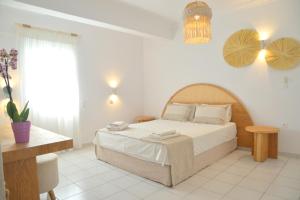 Postel nebo postele na pokoji v ubytování Hotel Apartments Giannis