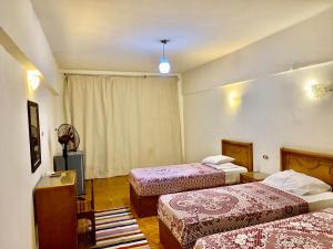 Кровать или кровати в номере Semiramis Hotel Royal Palace