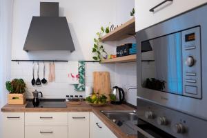 a kitchen with a sink and a microwave at La Zagara Holiday House - Cetara - Amalfi Coast in Cetara