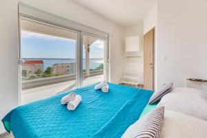 Postel nebo postele na pokoji v ubytování APARTMENT LanaTea ***SEA VIEW***