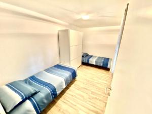 Postel nebo postele na pokoji v ubytování Guesthouse L&K
