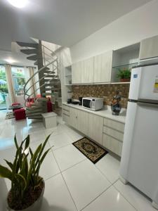Η κουζίνα ή μικρή κουζίνα στο Mandakaru Flats De Luxo