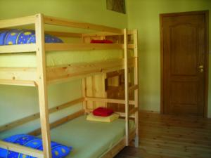 a room with three bunk beds in a room at Hostel Mostel in Veliko Tŭrnovo