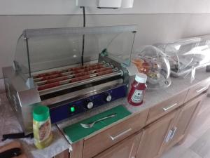 a model of a kitchen with a hot dog grill at eden in Cannobio