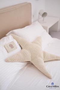 A bed or beds in a room at Cavo Milos