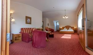 Postel nebo postele na pokoji v ubytování Hotel Garni Elisabeth
