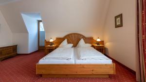 Postel nebo postele na pokoji v ubytování Hotel Garni Elisabeth