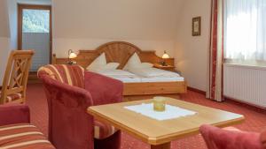 Postel nebo postele na pokoji v ubytování Hotel Garni Elisabeth